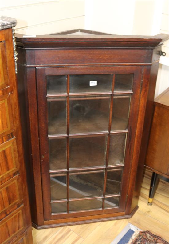 A late 18th century oak glazed hanging corner cupboard W.80cm